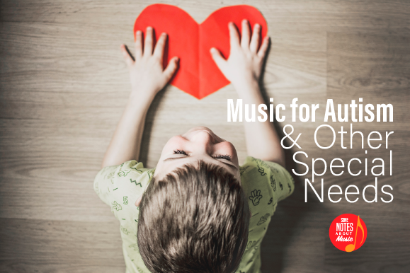 A boy holding a paper heart with the words music for autism & other special needs written on it.