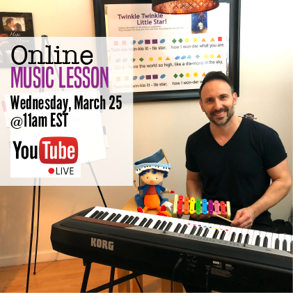 A man sitting at a keyboard with a toy.