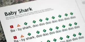 A sheet of paper with the word " shark " written in green.