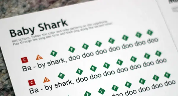 A sheet of paper with the word " shark " written in green.