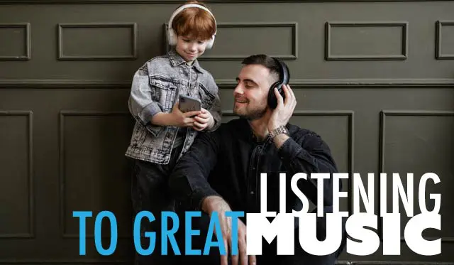 A man and boy with headphones on listening to music.