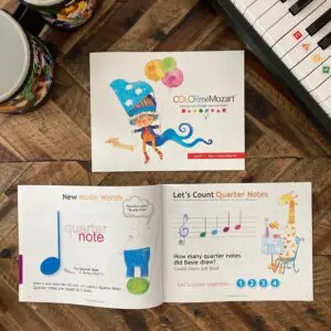 A book with pictures of musical instruments and notes.