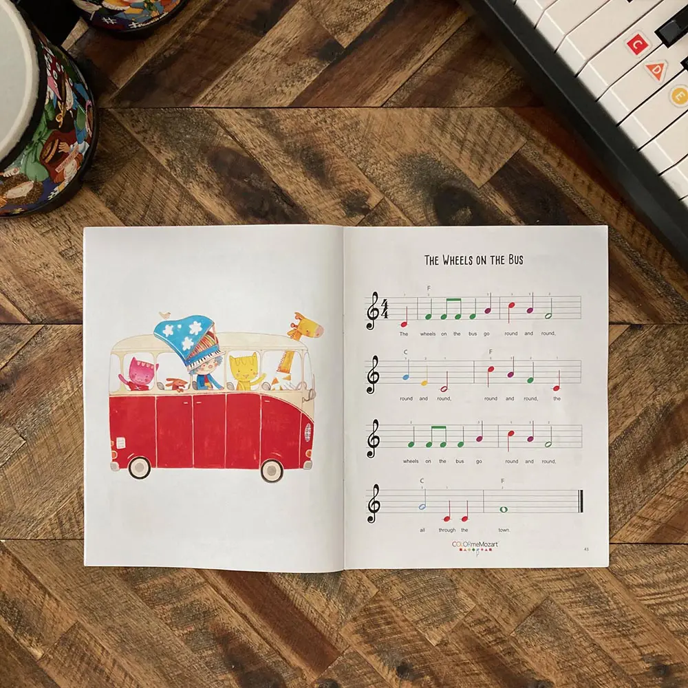 A book with music notes and a picture of a car.