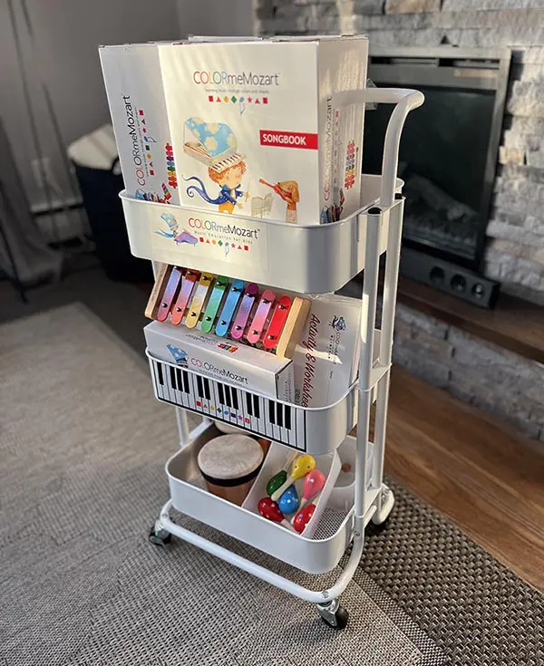 A white cart with books and music on it.