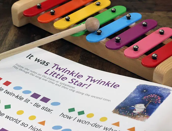 A colorful xylophone and some other toys