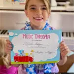 Nicole Elyse with Color Me Mozart diploma