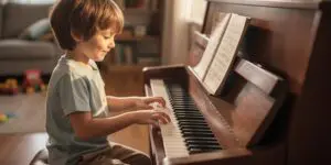 Preschooler playing piano during homeschool music time