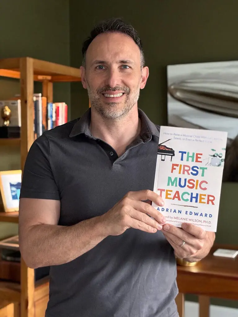 Adrian Edward with his book, The First Music Teacher