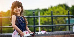 Little Girl Playing Guitar