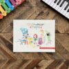 A book with pictures of children and instruments.