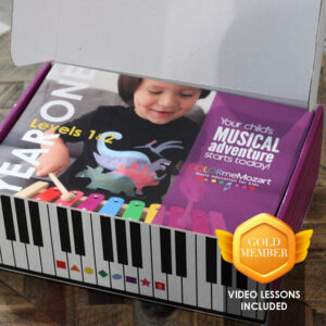 A box with a child playing on the piano