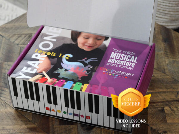 A box with a child playing on the piano