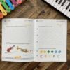 A book with music notes and shapes on it.
