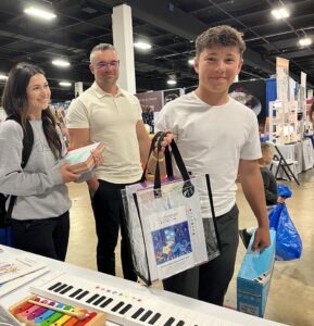 A group of people standing around a table with musical instruments.